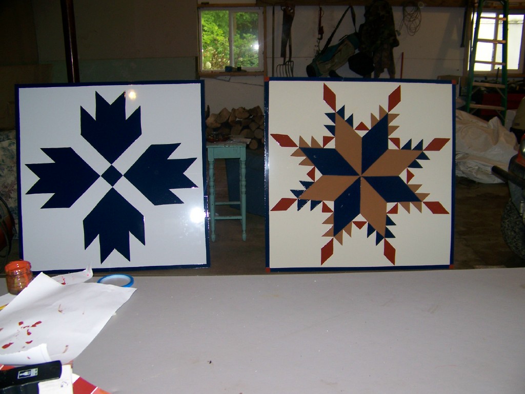 Freshly painted barn quilts