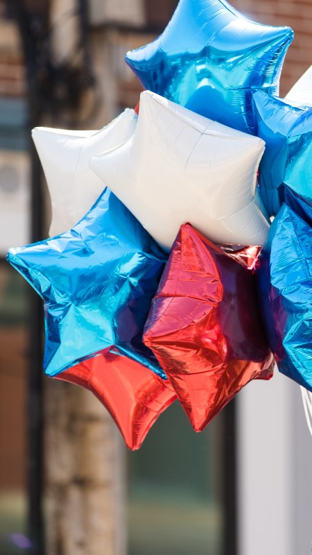 Red white and blue balloons at a parade