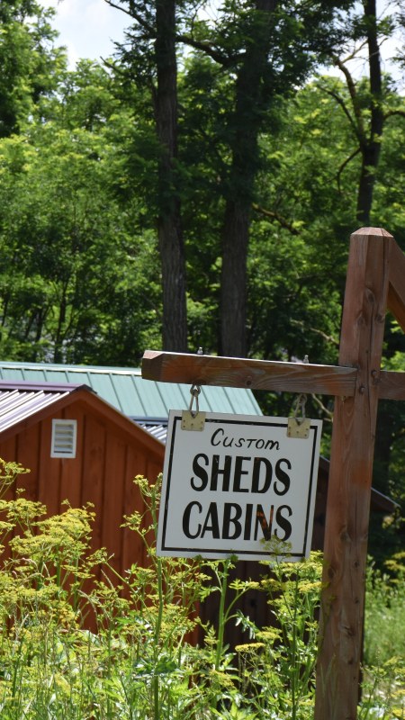 Sheds and Cabins sign