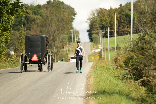 Walker by a horse drawn buggy taken by Mike Frame