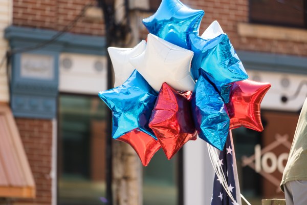 Red white and blue balloons at a parade