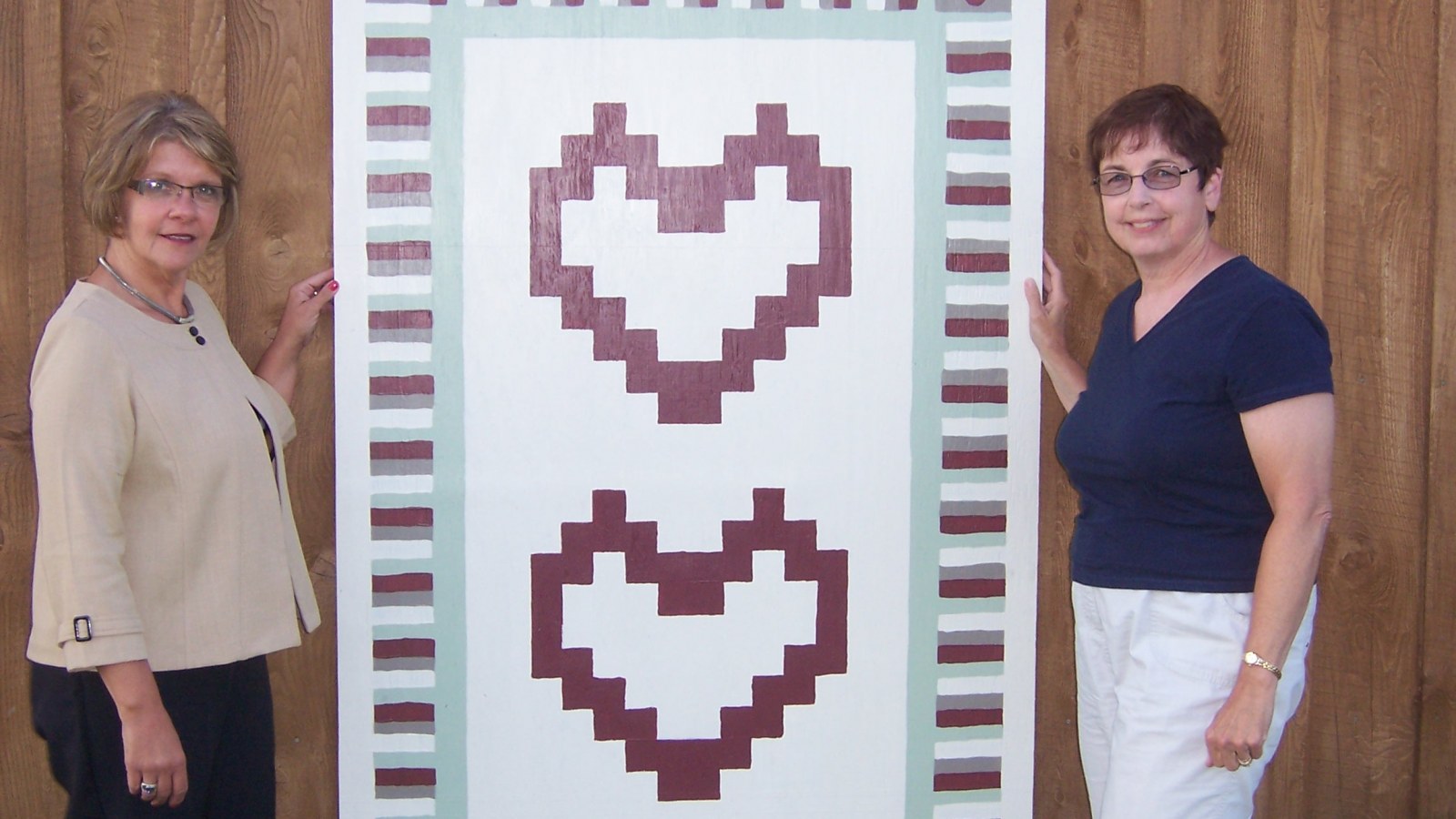 Crystal Abers and Sue Sandy with a Barn Quilt