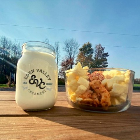 Finished cheese curd and glass of milk